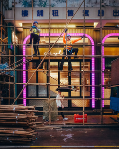 Construction workers tend to the bamboo scaffolding in Kowloon, Hong Kong.