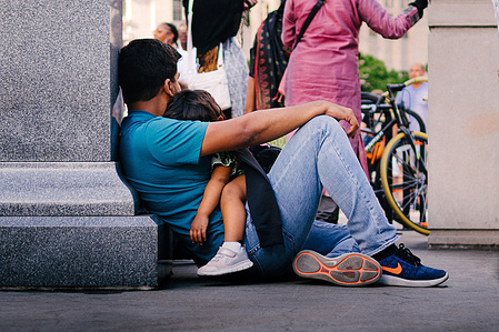 A father and sun share a moment of peace in Chicago, USA.