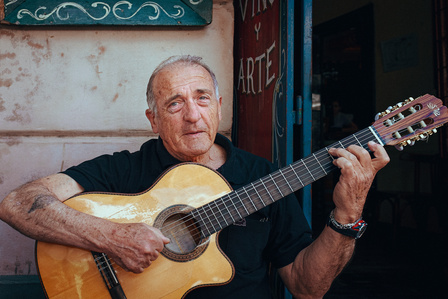 Man strums his guitar in Buenos Aires, Argentina. 