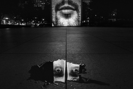 Reflection of a face from the Crown Fountain at Millennium Park in Chicago, USA.