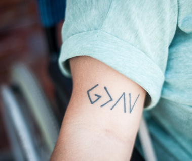 One of Bea's tattoos - God is greater than highs and lows