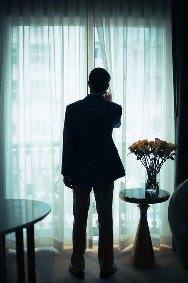 Man in window, book cover photography, thriller, hotel room