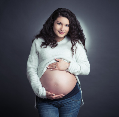 An image of a pregnant woman on a photoshoot