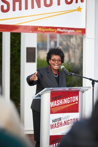 State Senator Mary Washington speaking to crowd at campaign event.