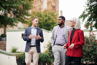State Delegate Mark Edelson walking with constituents in Baltimore City for political photo shoot.