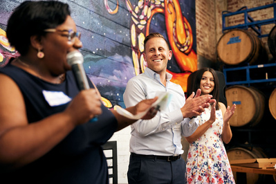 Delegate Mark Edelson listening to a politician at a campaign rally event in Baltimore, Maryland.