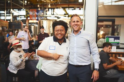 Maryland State Deledate candidate Mark Edelson poses for a portrait with a constituent in Baltimore City Maryland during a political event.