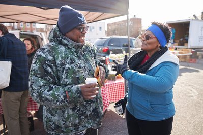 Political candidate, State Senator Mary Washington campaign canvassing at farmers market.