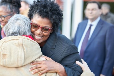State Senator Mary Washington hugging supporter at campaign event in Baltimore, Maryland.