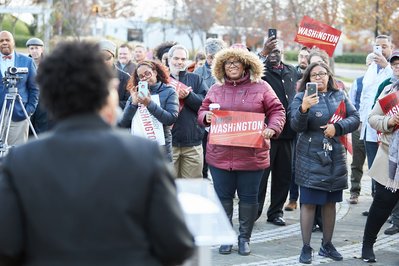 Crowd listening to State Senator Mary Washington at campaign event in Baltimore, Maryland.