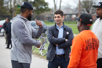 Maryland State Delegate candidate listening to constituents during a community event in Baltimore City Maryland.