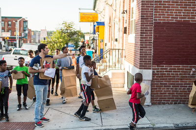 Political candidate Nate volunteering with constituents during a political campaign photo shoot in Baltimore Maryland
