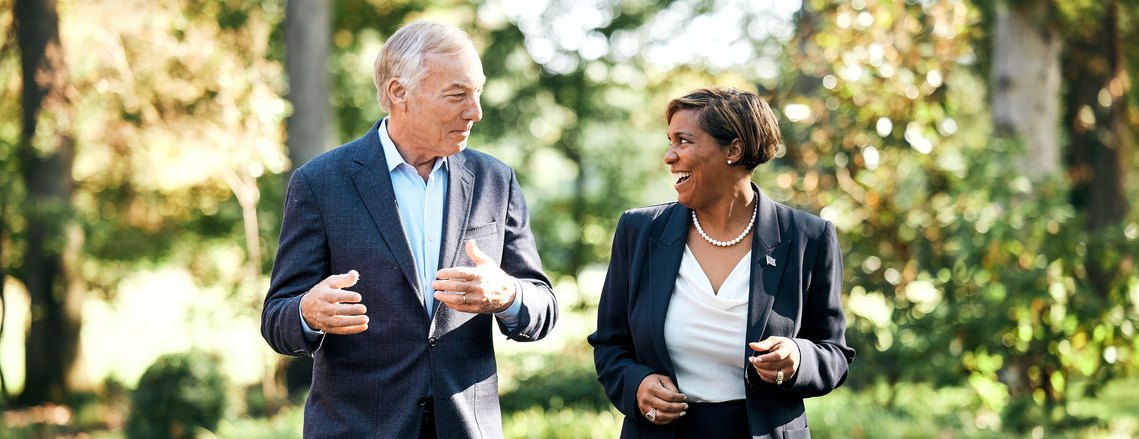 Politicians Peter Franchot and Monique Anderson Walker talking to each other for political portraits.