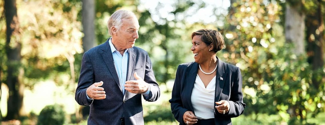 Peter Franchot walking with running mate for a political campaign portrait.