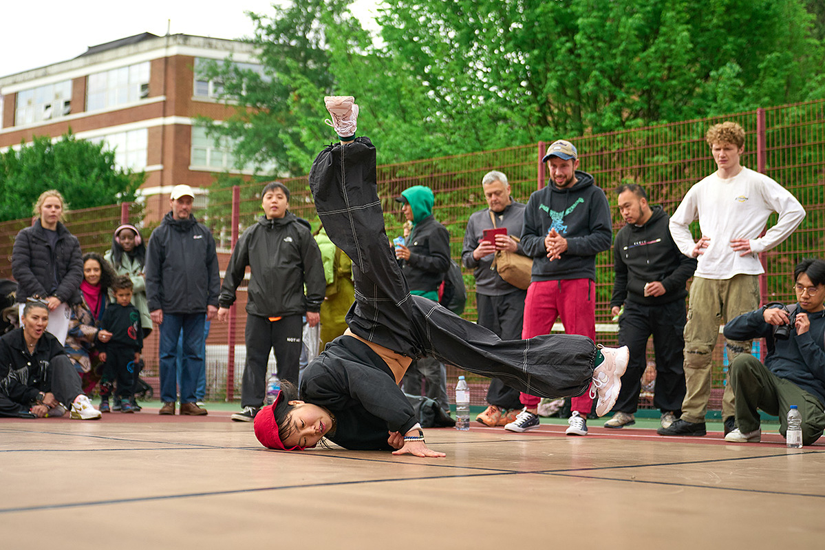 A BGirl doing windmills at Breakin Convention Park Jam 2025