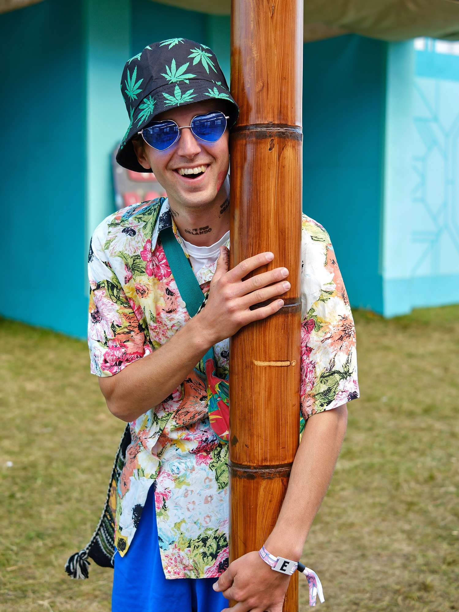 a raver party animal wearing a bucket hat looks like hunter s thompson