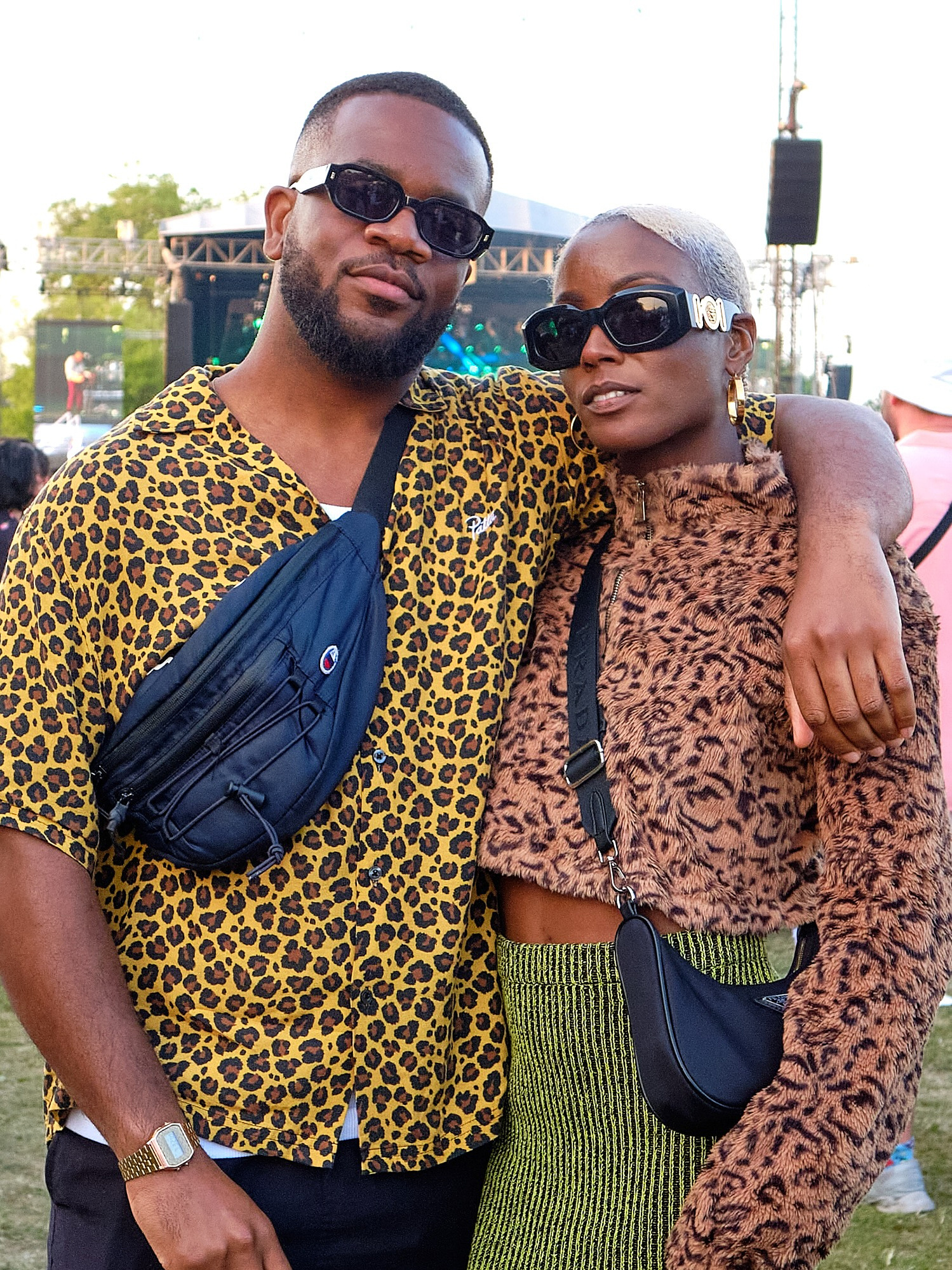 Estee Blu and her partner wearing stylish fashion and leopard print pose for a street portrait at Cross The Tracks 2023