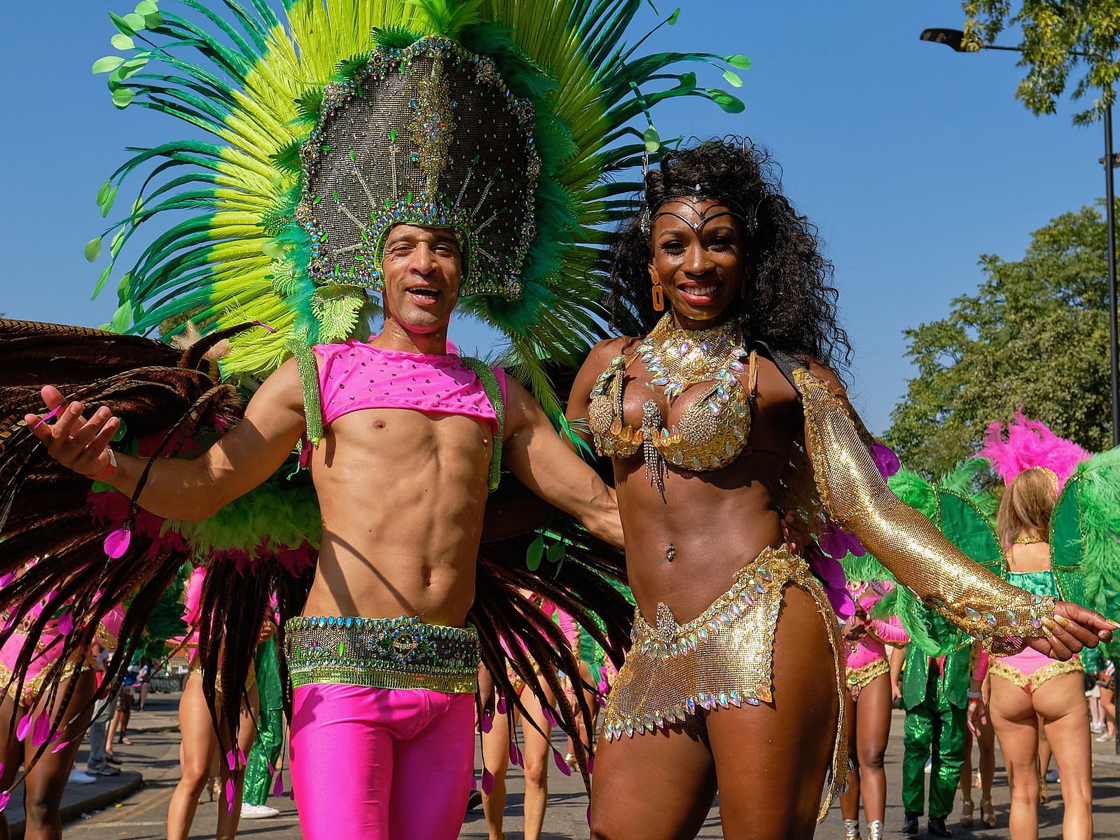 two Paraiso School of Samba performers pose for a street portrait