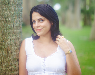 woman posing against tree