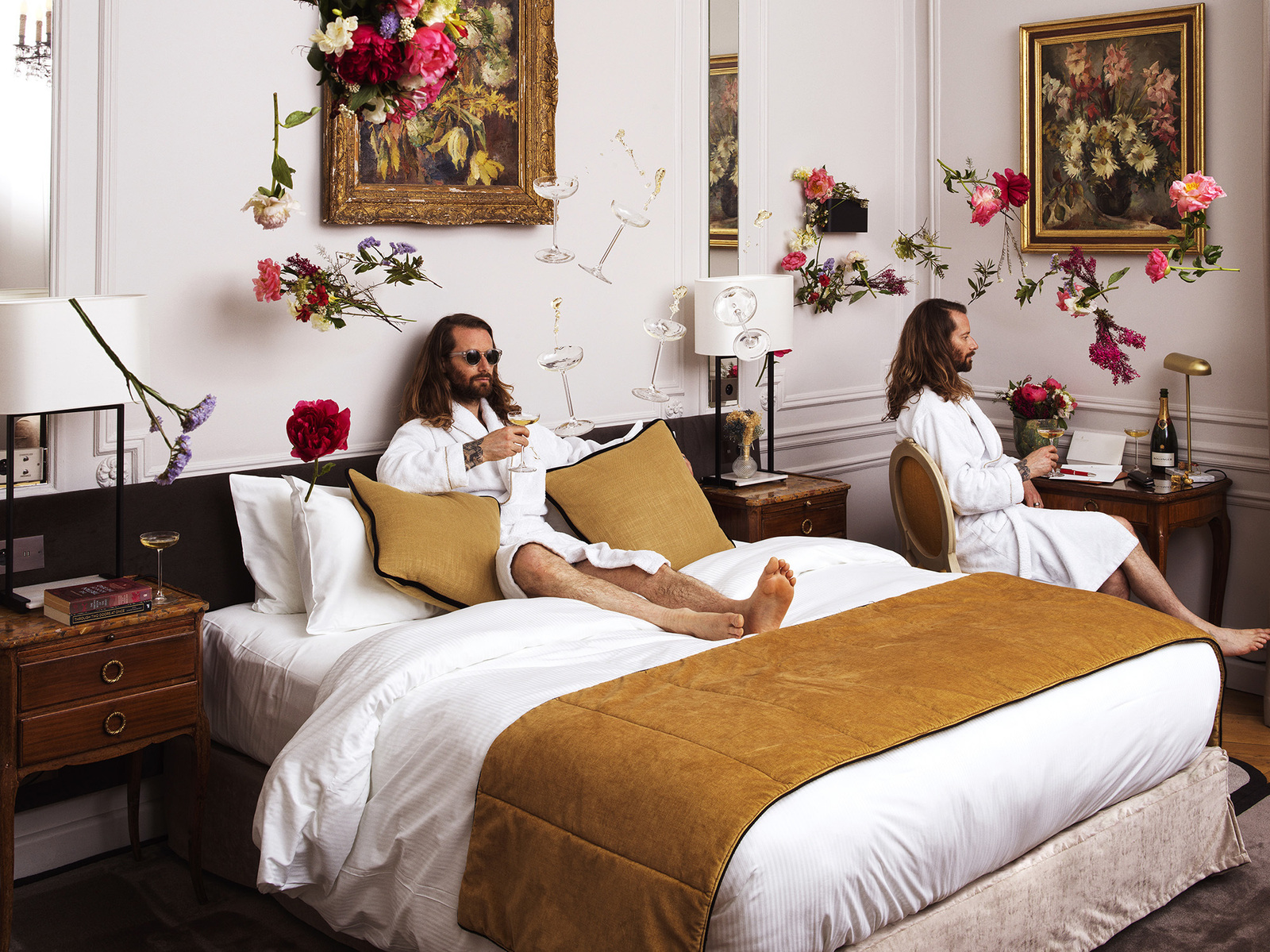 Two identical men in hotel room with floating flowers and champagne glasses.
Camera Hasselblad 50 CFV ii.
"Duality in Bloom" - The Multifaceted Nature of Travel
In this dreamlike hotel interior, reality splits and blurs. The doppelgänger effect, combined 