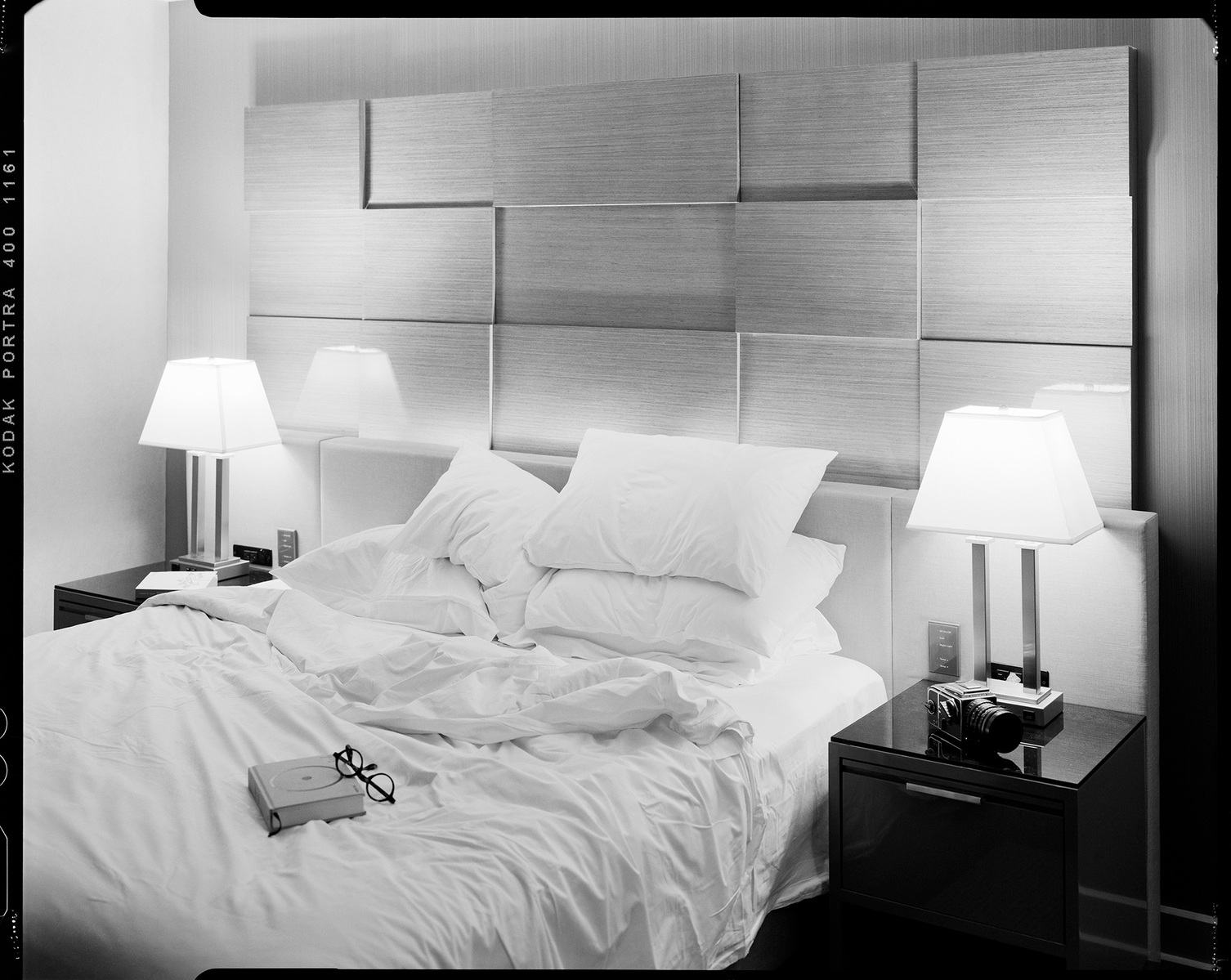 Black and white image of rumpled bed in luxury hotel room with geometric headboard
"Imprints of Absence" - Conceptual Bed Imagery in High-End Hospitality Spaces
