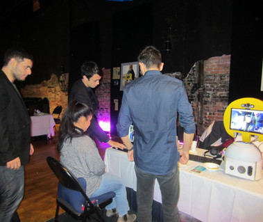 A group of people demonstrating how to use their new technology.