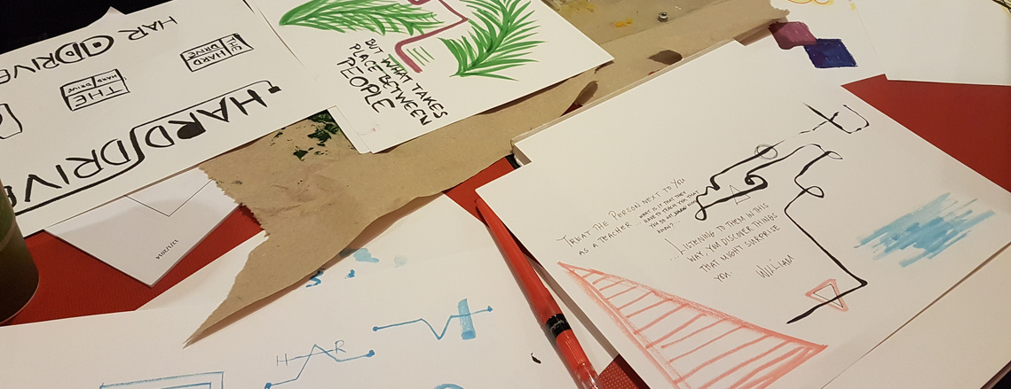 Sheets of paper with different illustrations of 'The Hard Drive' and quotes.