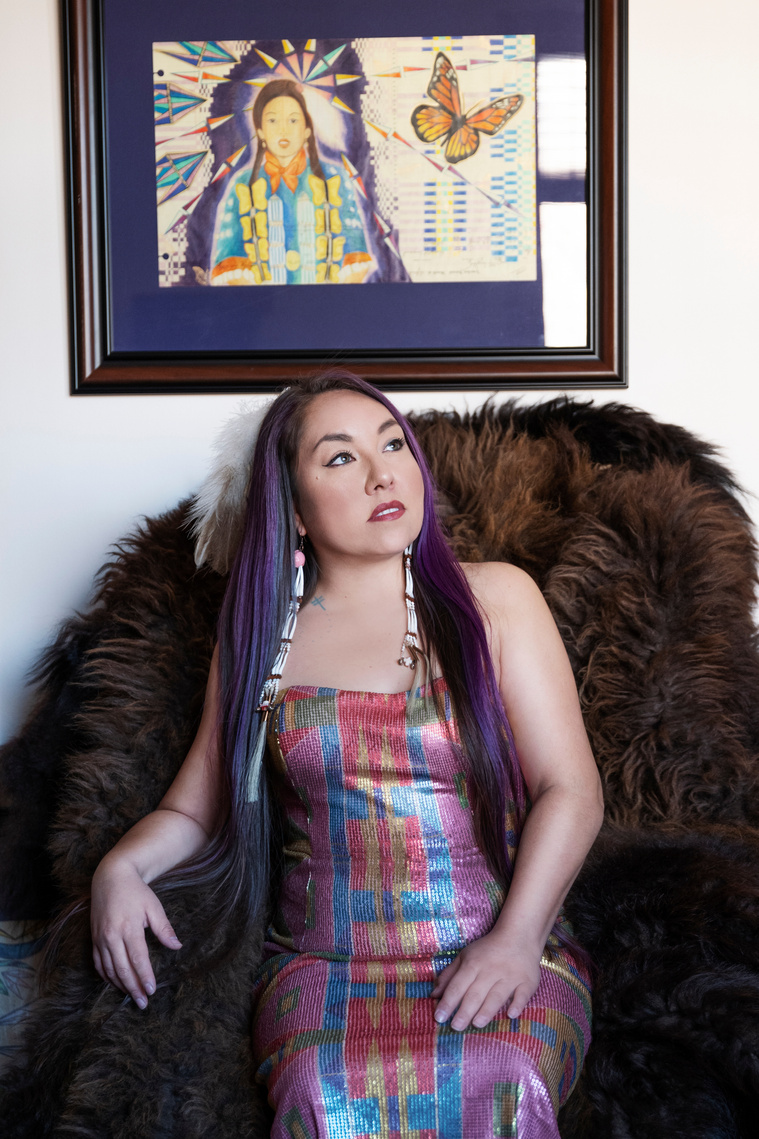 DeborahAnderson Photography 2021 
Photo of Artist SunRose IronShell with ledger art buffalo robe and Byellowtail sequen dress Lakota woman sioux Oceti sakowyn 