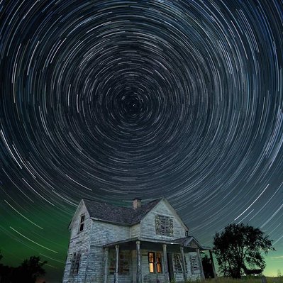 Startrails over abandoned homestead located in prairie region of Manitoba. 