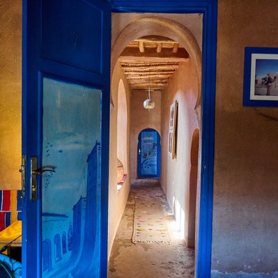Moroccan photograph featuring a beautiful door and hallway in a Riad. 