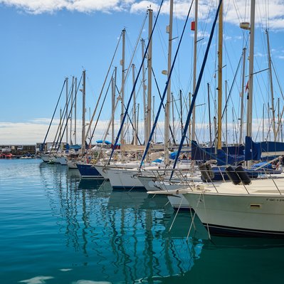 Gran Canaria landscape photograph featuring sailboats in the Mogan harbour.