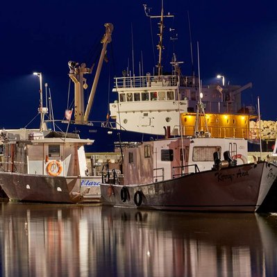 Gimli harbour evening with fishing boats and Namao research vessel. 