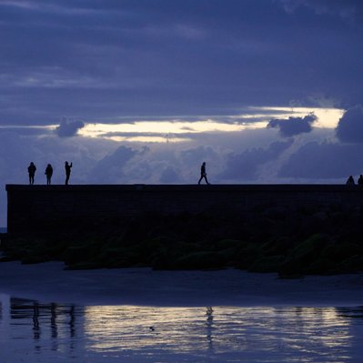Gran Canaria landscape photograph featuring walkway out into the ocean by the Maspalomas lighthouse. 