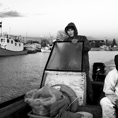 Old Gimli fishers start out from the harbour to check their nets for fish.