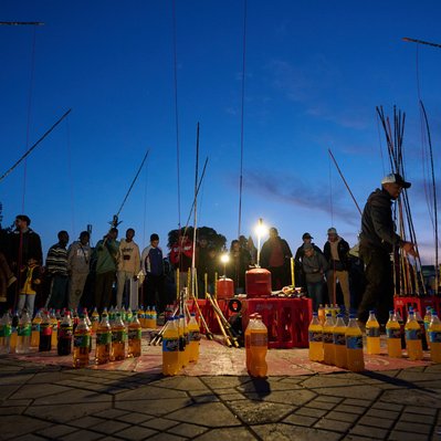 A photograph featuring a bottle game in the Marrakesh Marketplace.
