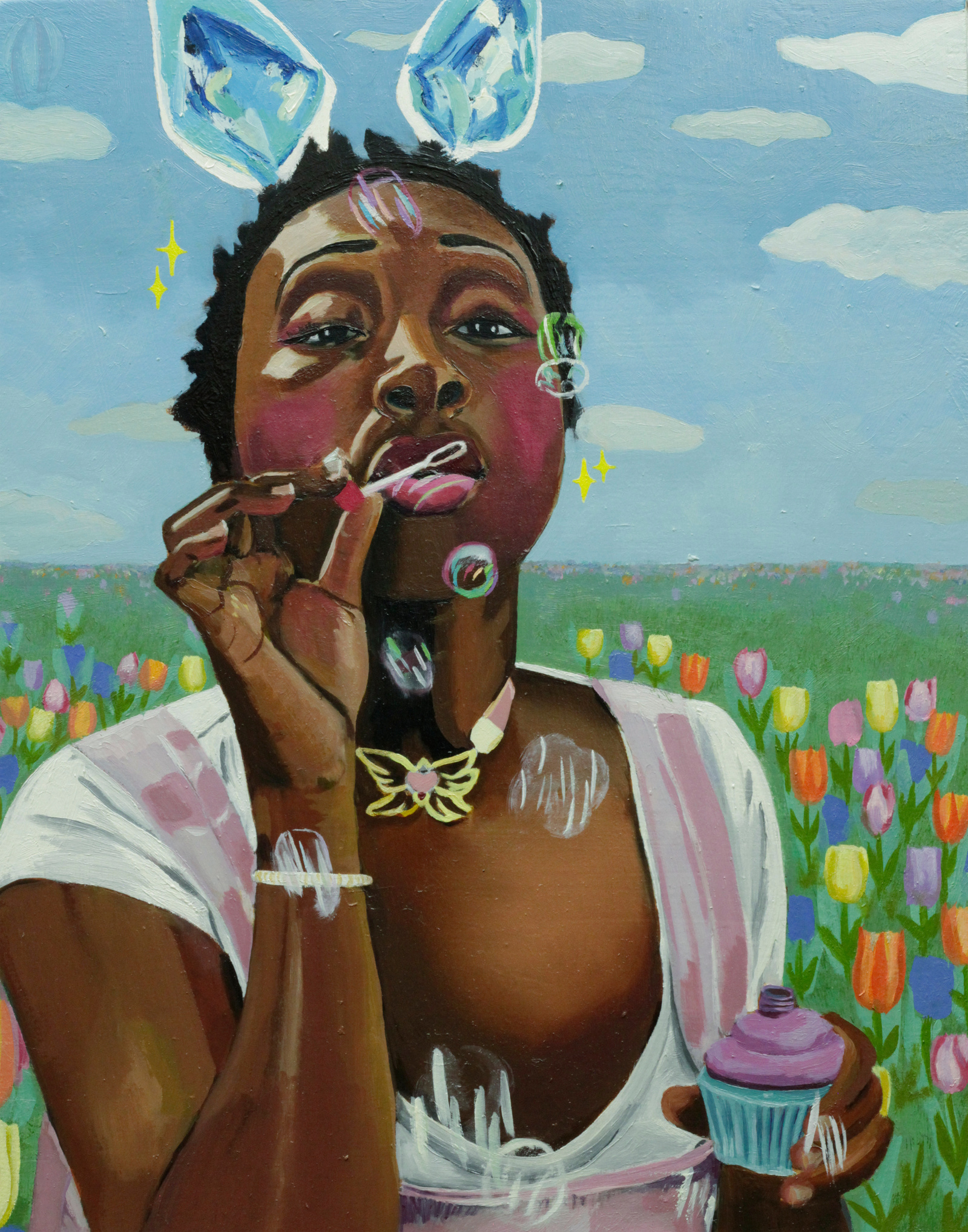 girl with foil bunny ears blowing bubbles in a grassy field with tulips. Out of focus soap bubbles on a sunny day