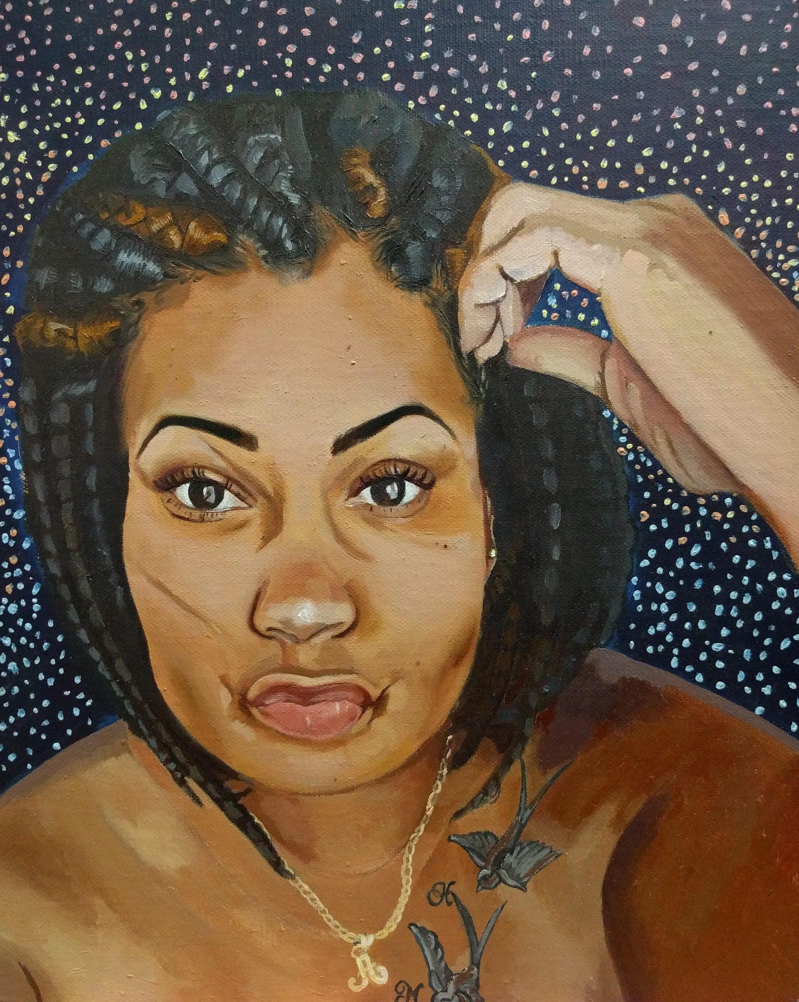 portrait of black woman with braids and tattoo of birds, gold necklace, pouty