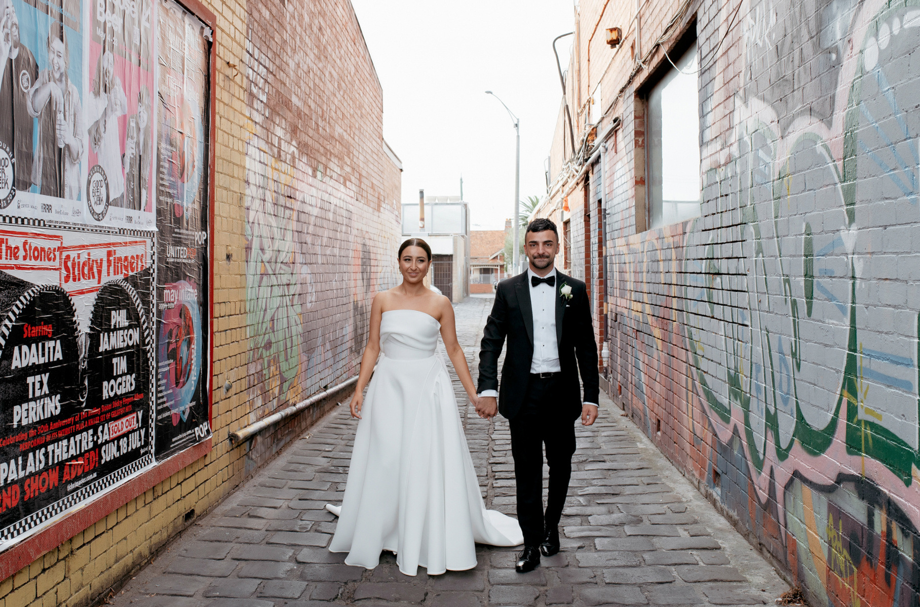 graffiti lane husband and wife holding hands