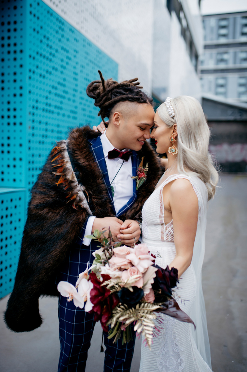 bride and groom looking at each other with foreheads touching 
