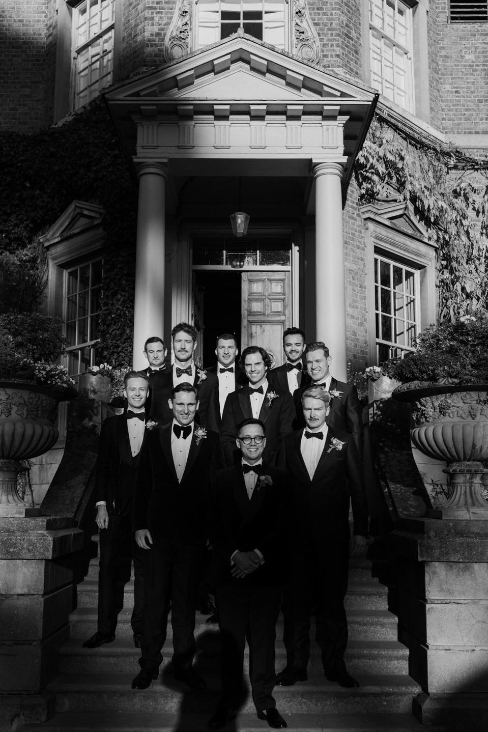 Groomsmen outside Hampton Court house