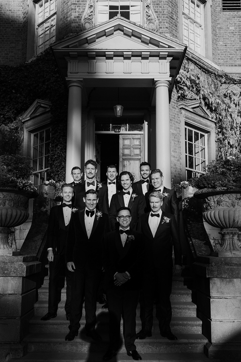 Groomsmen outside Hampton Court house