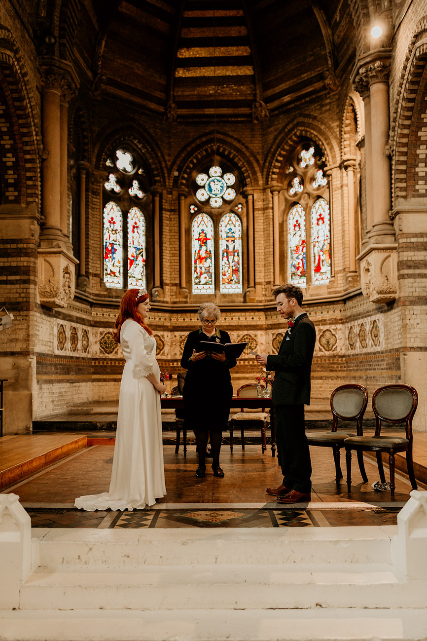 bride and groom at the altar in St Stephen's, Rosslyn Hill