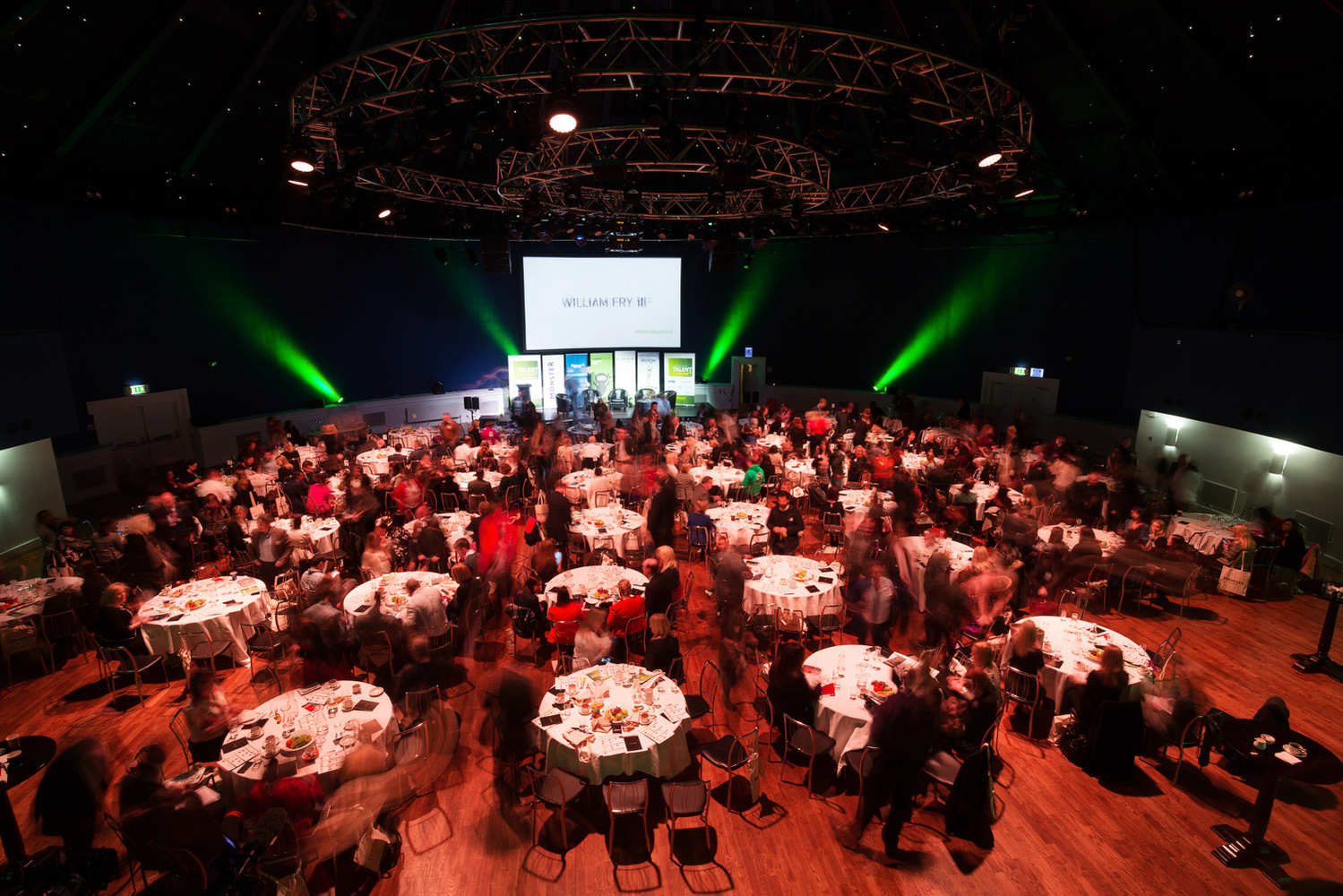 Arial overview photo of a busy conference setup, attendees and tables, The Round Room, The Mansion House, Exhibition and Event Photographer Dublin