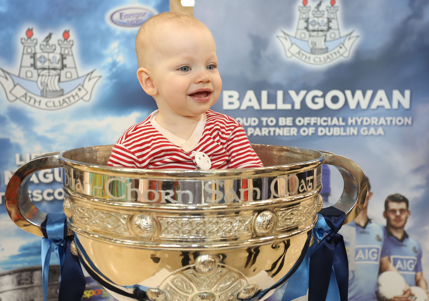 Instore publicity photography for Ballygowan young baby sitting in the Sam Maguire cup. Event photographer dublin 
