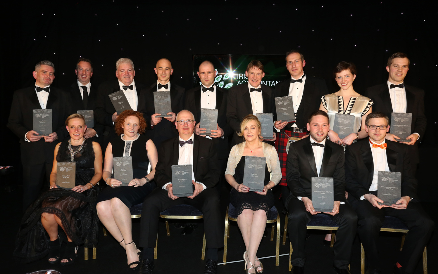 Large group photo of winners on stage at the Irish Accountancy Awards in Dublin.  Professional Event and Awards Photography services 