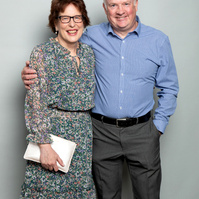 Corporate social event photo of guests against a grey studio background. Photo printed onsite at the event www.eventimage.ie