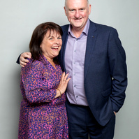 Corporate social event photo of guests against a grey studio background. Photo printed onsite at the event www.eventimage.ie