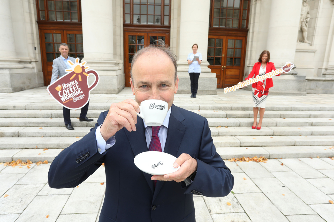 An Taoiseach Micheál Martin launches the Bewleys 28th Hospice Coffee Morning at a press PR Media Photocall outside government buildings. Professional PR Photographer