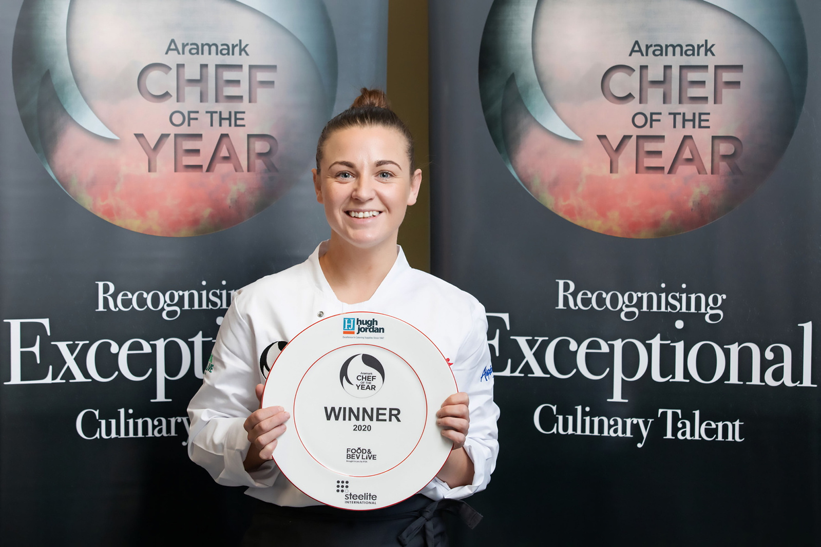 Female Chef holding her Award. Winner presentation Aramark Chef of the Year at Food & Beverage Live exhibition professional event photographer Dublin 