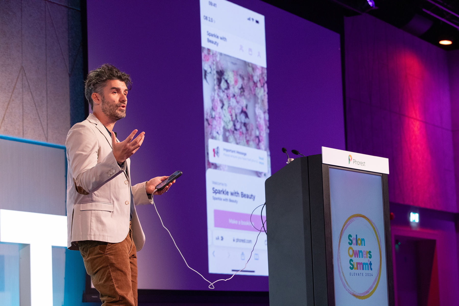Live Event photography Dubin, male speaker on stage at Salon Owners Summit 2024 in Dublin Royal Convention Centre